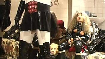 Ebony Babe Poses in Black Rubber Outfit