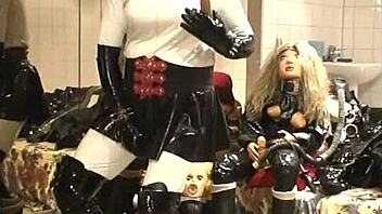 Ebony Babe Poses in Black Rubber Outfit