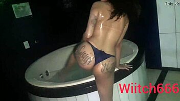 Bruxinha, brazilian milf prostitute, performs exhibitionism in bathtub with natural tits