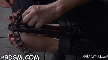 The gagged hotty is made to submit with toys and choking in this bdsm scene.