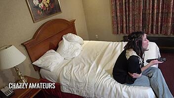 Curious barefoot hippy squatter watches Eileen Wournos on TV late night