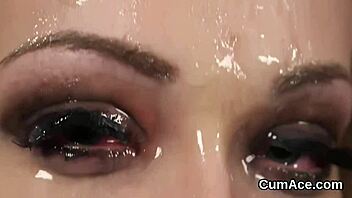 The unusual beauty receives a cumshot on her face and swallows it all.
