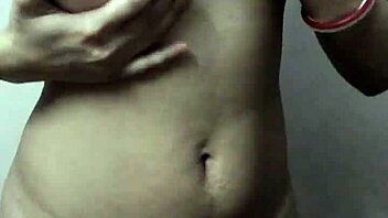Indian babe flashes her big tits in thong underwear