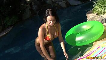 Busty blonde performs orange striptease.