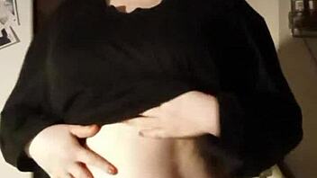 want to see this busty girl playing with her tits for free?