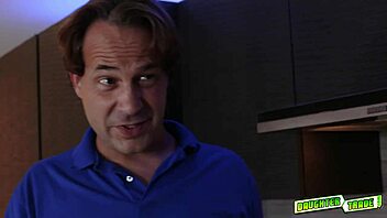 Teenagers participate in a group activity involving bending over in a dirty setting