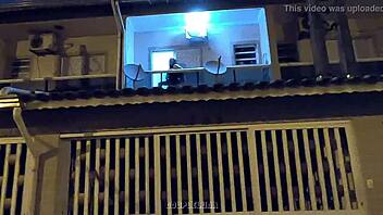 Amateur teen caught having sex in public on a balcony