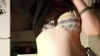 want to see this busty girl playing with her tits for free?