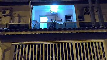 Amateur teen caught having sex in public on a balcony