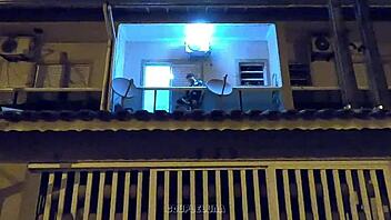 Amateur teen caught having sex in public on a balcony