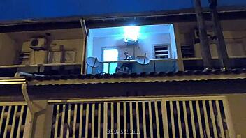 Amateur teen caught having sex in public on a balcony