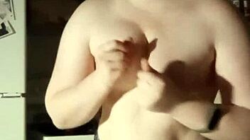 want to see this busty girl playing with her tits for free?