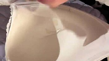 creamy cumshot lands on padded bra during wanking session
