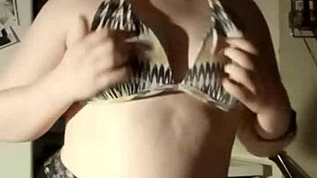 want to see this busty girl playing with her tits for free?