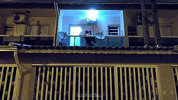 Amateur teen caught having sex in public on a balcony