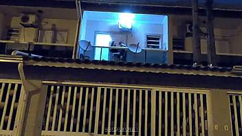 Amateur teen caught having sex in public on a balcony