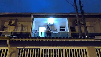 Amateur teen caught having sex in public on a balcony