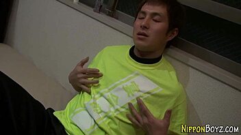 Japanese gay hunk tugs his hard cock