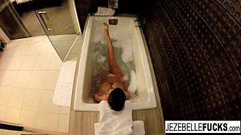 Jezebelle Bond Feels Aroused Masturbating In The Bath, Showing Big Tits And Wet Pussy