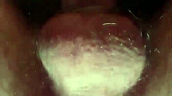 Cum-filled condom from anal fucking with throbbing cock