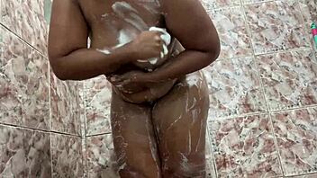 Watch this ebony amateur shaking her big ass in the shower, feeling the water on her pussy.