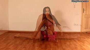 Flexible brunette Nina shows off her ballerina skills in a sexy video