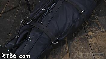 Watch a submissive man get bound and dominated in this rough BDSM scene