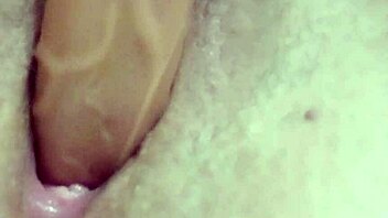 watch this sexy milf fingering herself with a dildo on webcam