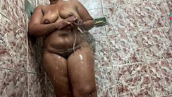 Watch this ebony amateur shaking her big ass in the shower, feeling the water on her pussy.