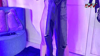 Desperate teen pisses on her black jeans in a fetish scene