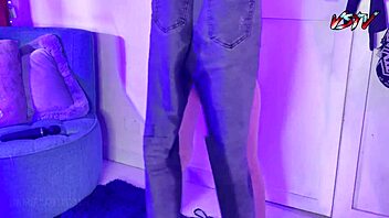 Desperate teen pisses on her black jeans in a fetish scene