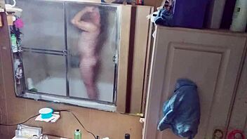 Long-haired beauty in panties and briefs in mirrored bathroom