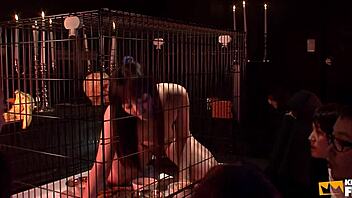 japanese babe trapped in cage eats and pisses before a crowd of guys. her hairy petite frame shocks!