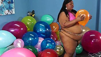 aminah the ebony model gorges on whipped cream while popping balloons with her fingernails