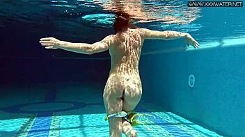 Nicole Pearl, the hottest MILF, enjoys a swim in the sea