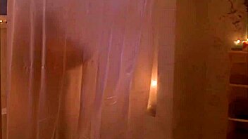 tania saulnier in a steamy shower scene