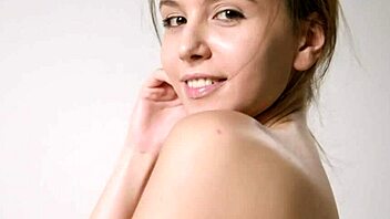 A beautiful woman with natural tits teasingly revealing her slender body