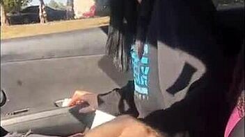 Lesbian friend enjoys car ride handjob