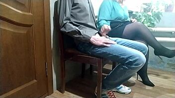 Milf in pantyhose gives me a handjob in public