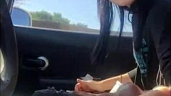 Lesbian friend enjoys car ride handjob