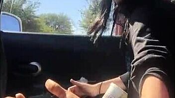 Lesbian friend enjoys car ride handjob