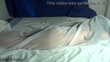 Silly Girl Poses Naked Under Sheets
