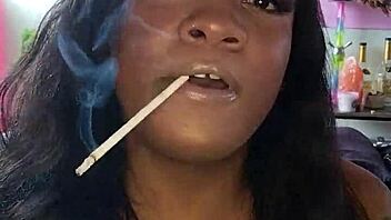 Dominant black goddess smokes and dominates in kinky video