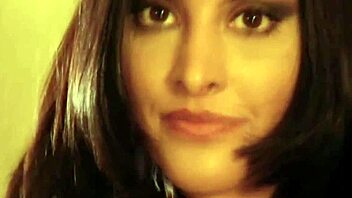 bollywood babe strips naked on the bed for handjob