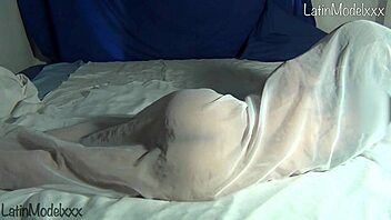 Silly Girl Poses Naked Under Sheets