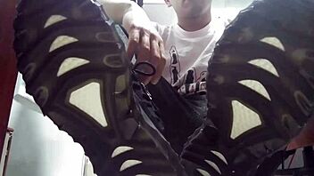 Twink shows off long green socks and sweaty feet up close