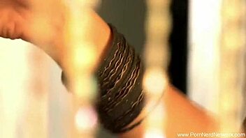 bollywood babe strips naked on the bed for handjob