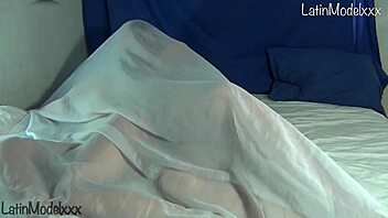 Silly Girl Poses Naked Under Sheets