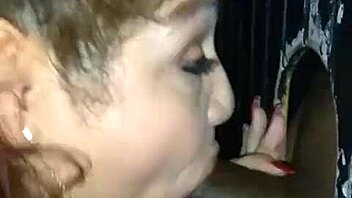 Rae Lynn takes a mouthful of BBC cum at gloryhole