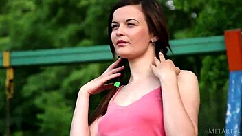 Ukrainian pornstar Dulcia flaunts her hairless pussy in the great outdoors